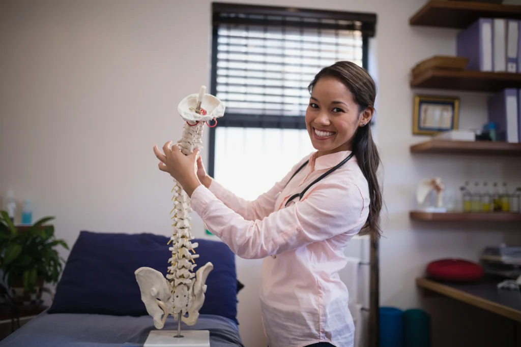 is chiropractic safe female chiroprator holding bones tio chiro