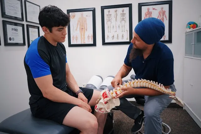 slip disc chiropractic man giving advice to patient tio chiro