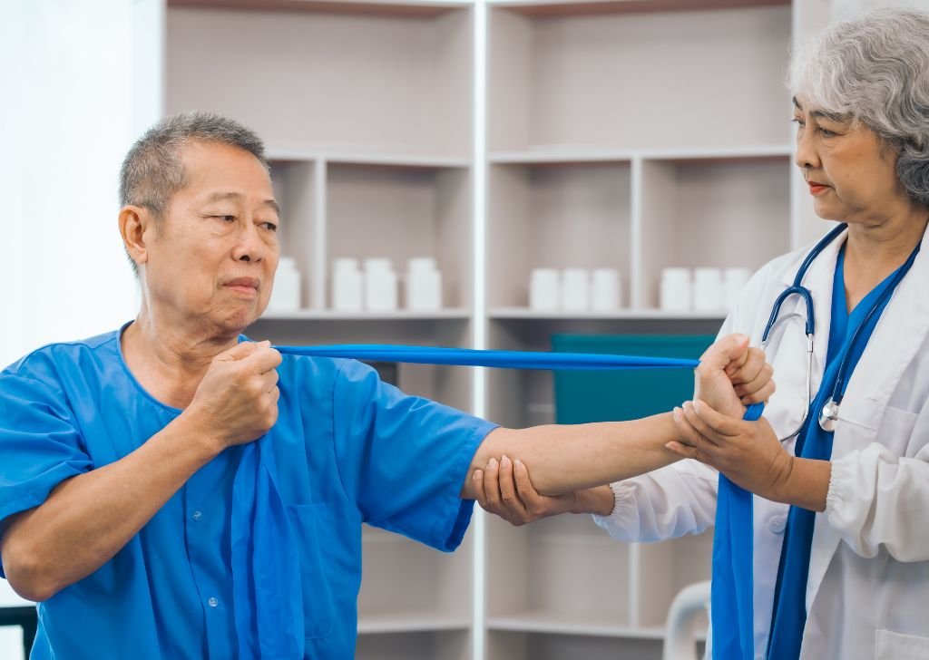 An elderly patient going through a treatment session with a Physiotherapist in Petaling Jaya.
