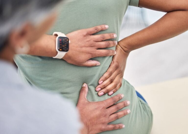 Patient at a Physiotherapy center getting checked for that tingling sensation in lower back.