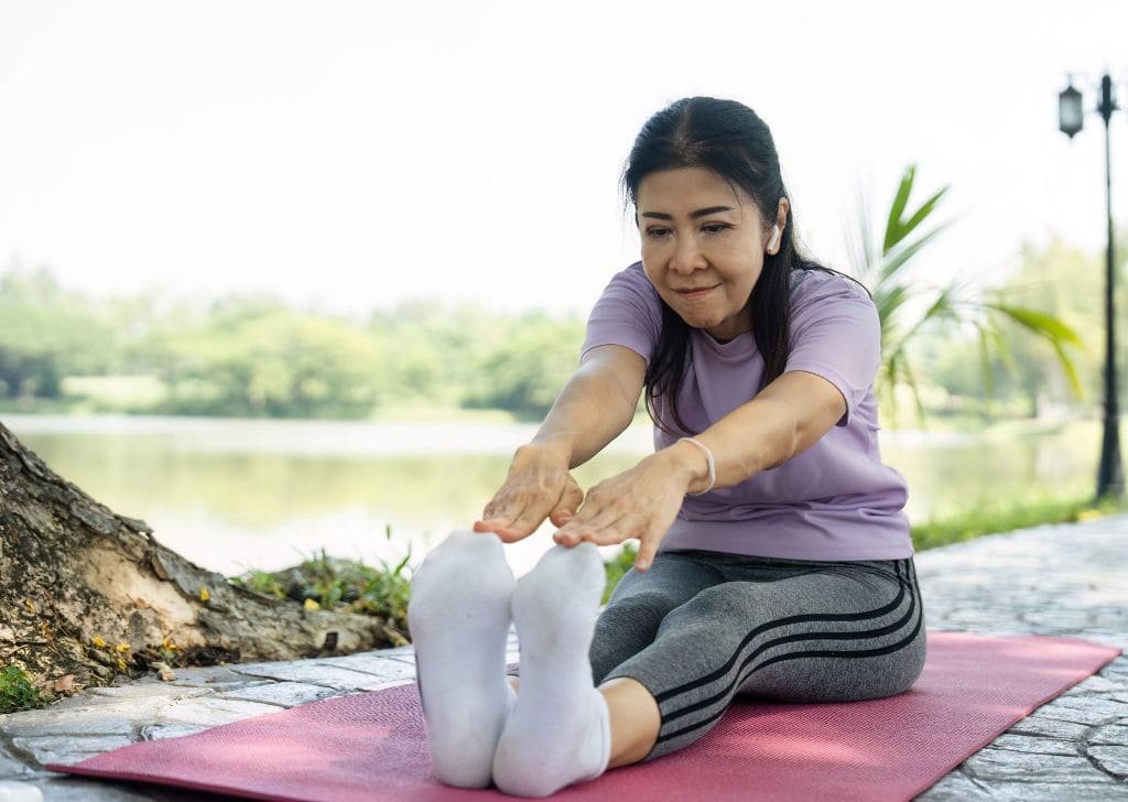 Middle aged woman gaining joint mobility after dry needling treatment in Petaling Jaya. 