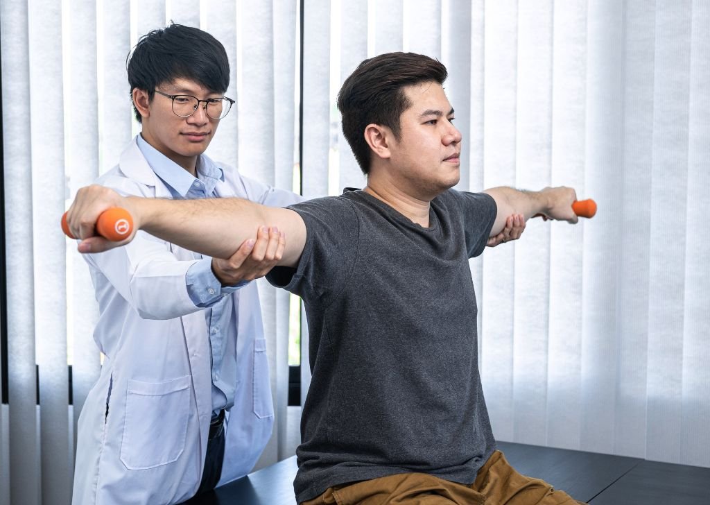 A chiropractor assessing a patient's movement.