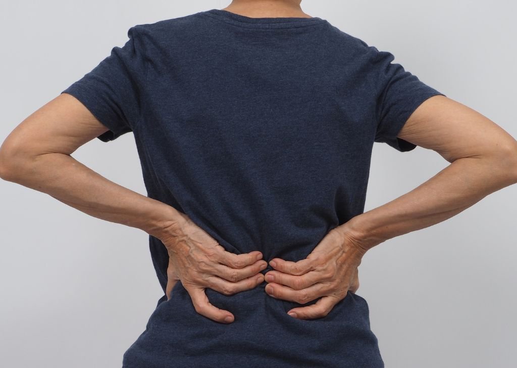 A patient suffering from tingling and numbness in their lower back.