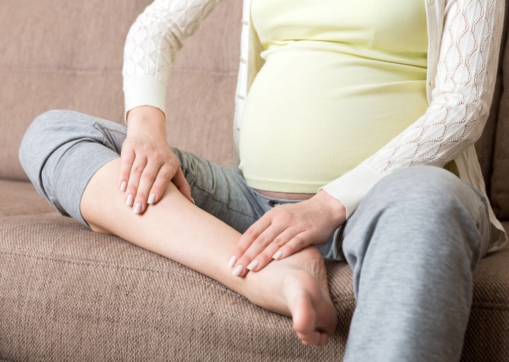 A pregnant woman experiencing leg cramps in Petaling Jaya.