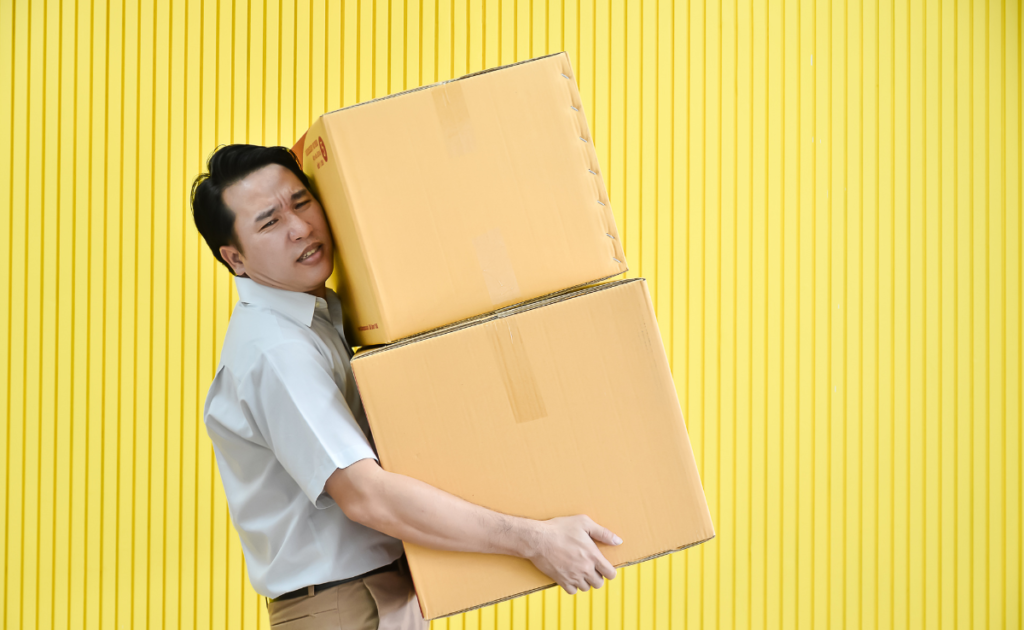 Man carrying heavy boxes
