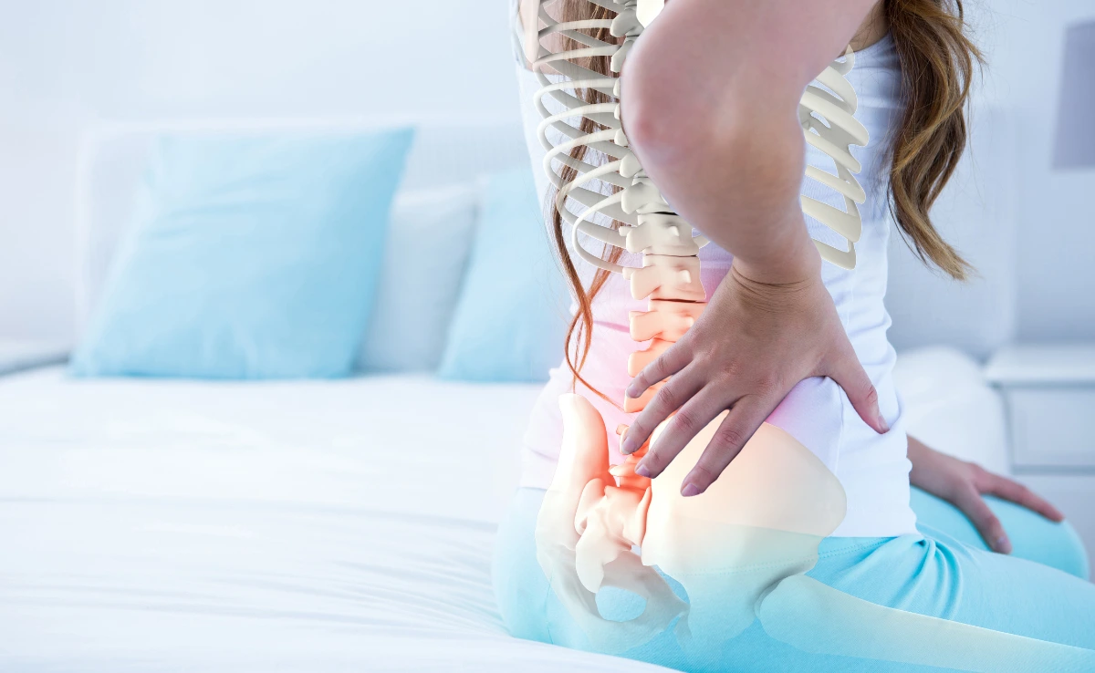 A cross section of an image of a woman having lower back pain.