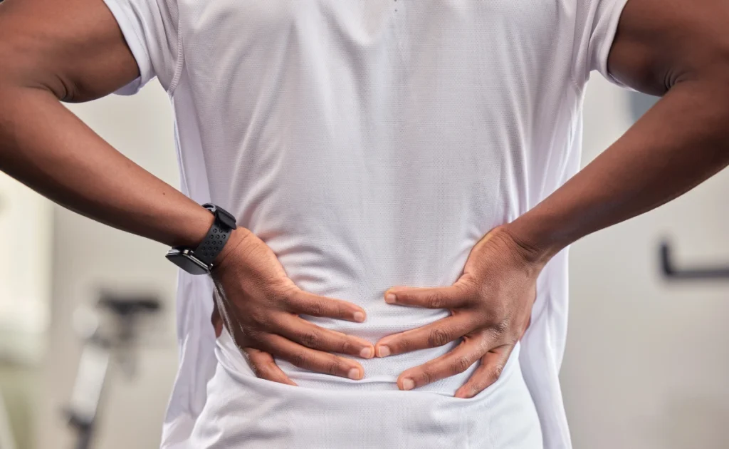 A person doing stretches to relieve lower back pain.