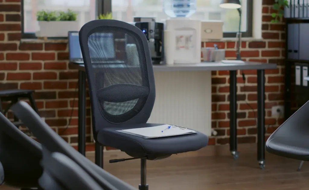 An image of an office chair in a cozy workstation.